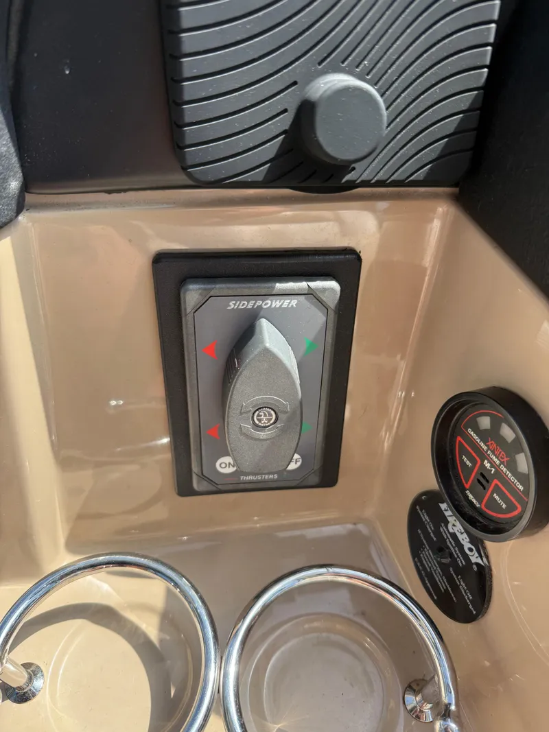 Slide: The Image of Control panel of a 2008 Four Winns V358 boat with Side-Power thruster switch. - 14