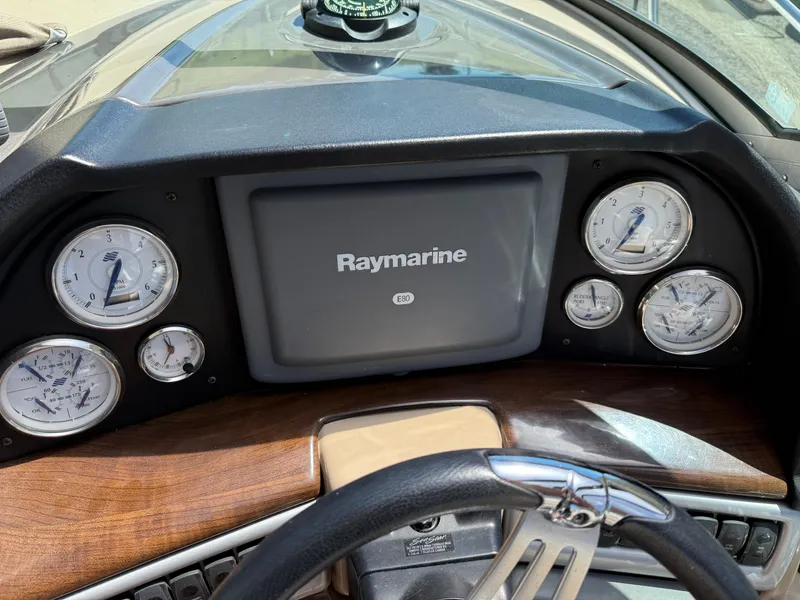 Slide: The Image of Dashboard of 2008 Four Winns V358 boat with Raymarine display and gauges. - 15