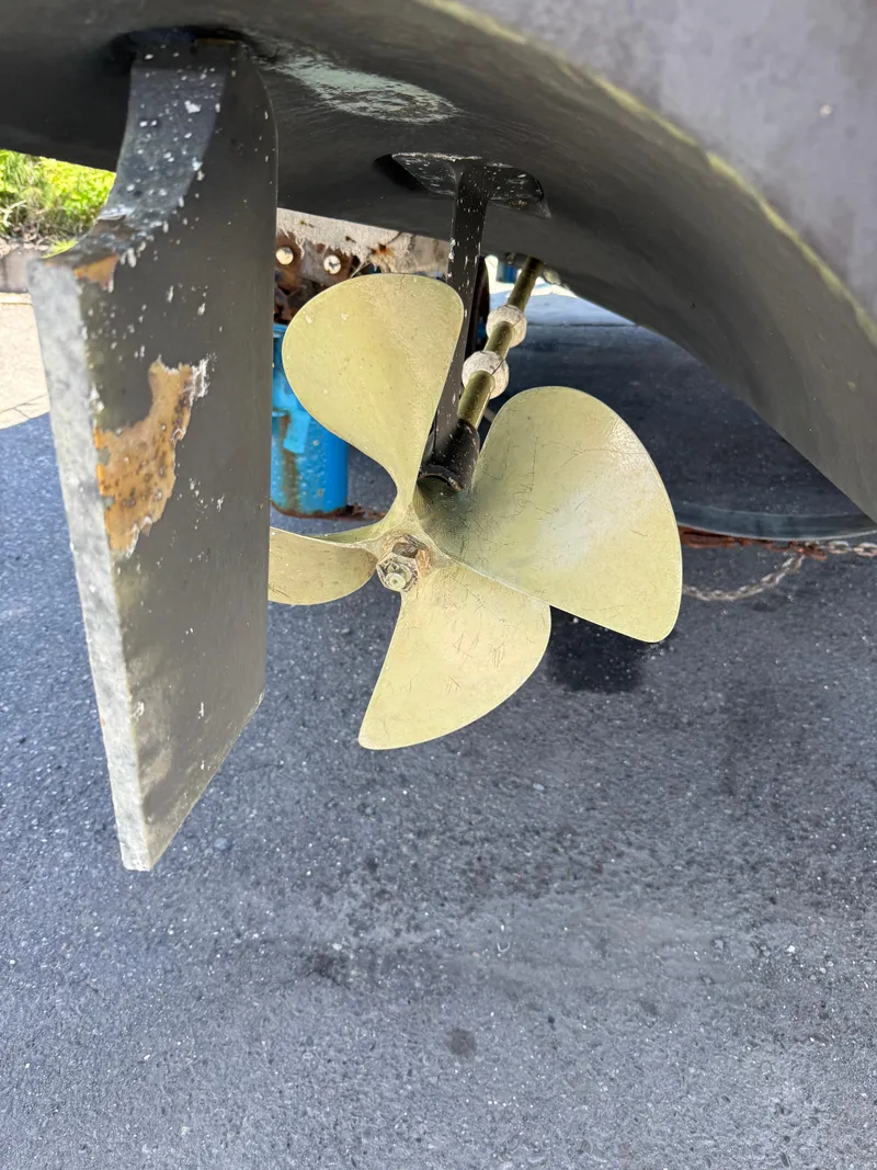 Slide: The Image of Propeller and rudder of 2008 Four Winns V358 boat on pavement. - 24