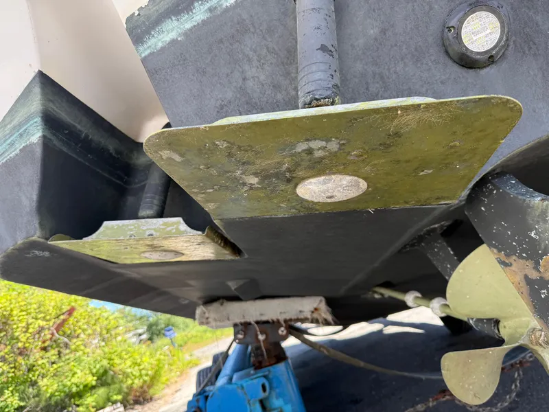 Slide: The Image of 2008 Four Winns V358 boat underside with propeller and trim tabs visible. - 26