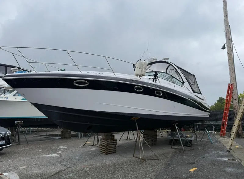 Slide: The Image of 2008 Four Winns V358 boat on dry dock, overcast sky background. - 6