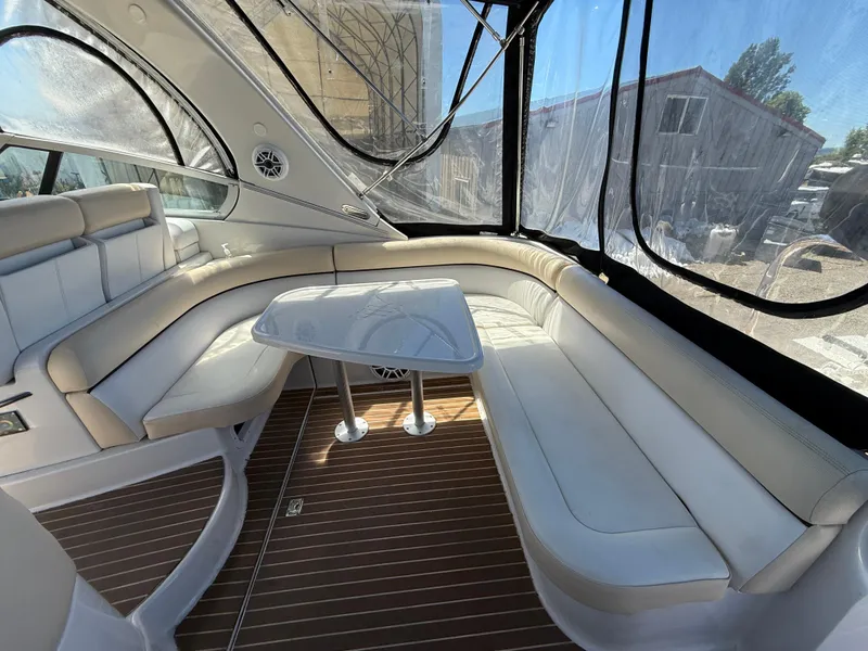 Slide: The Image of Luxurious 2008 Four Winns V358 boat interior with white seating and wooden flooring. - 8