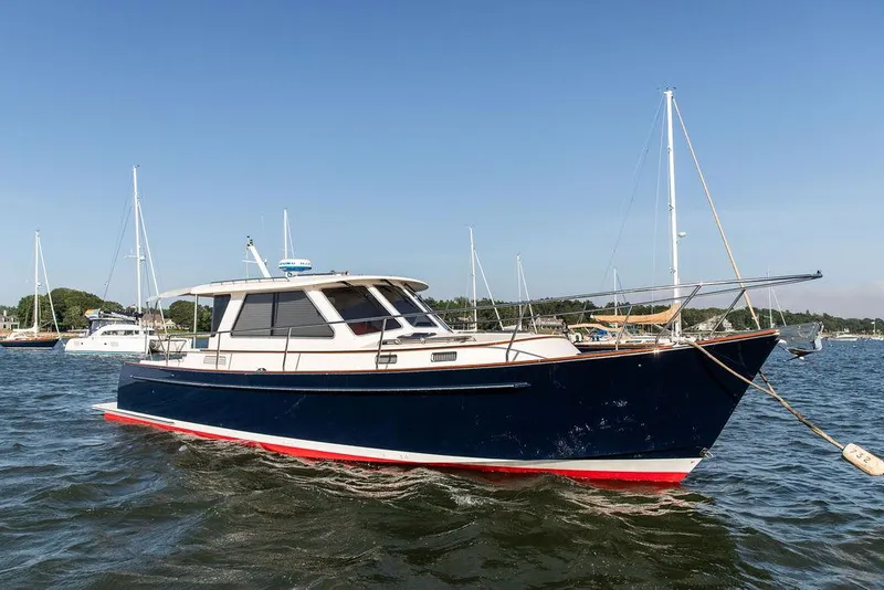 The Image of 2014 Bruckmann Abaco 40 yacht anchored in a scenic harbor. - 0