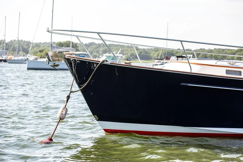 Slide: The Image of Bruckmann Abaco 40 yacht, 2014 model, anchored in calm waters with scenic background. - 14