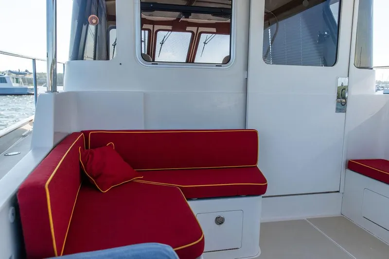 Slide: The Image of Red cushioned seating on 2014 Bruckmann Abaco 40 boat deck. - 21