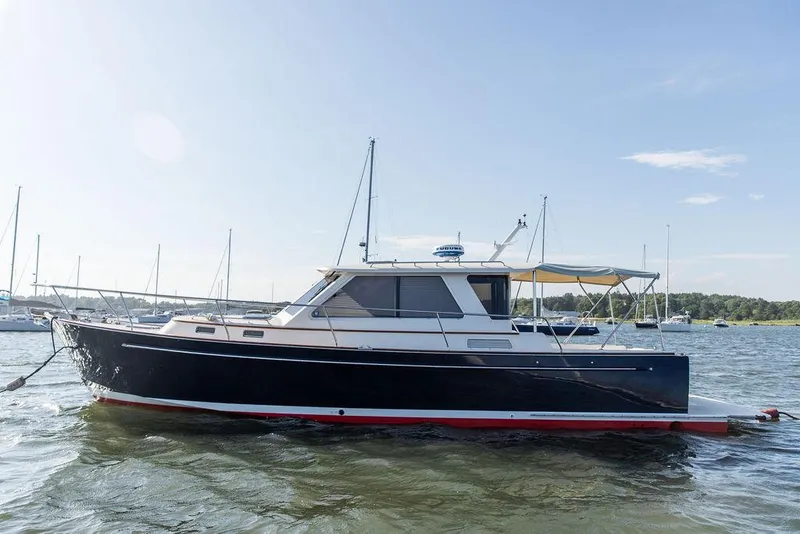 Slide: The Image of 2014 Bruckmann Abaco 40 yacht on calm water, clear sky background. - 3