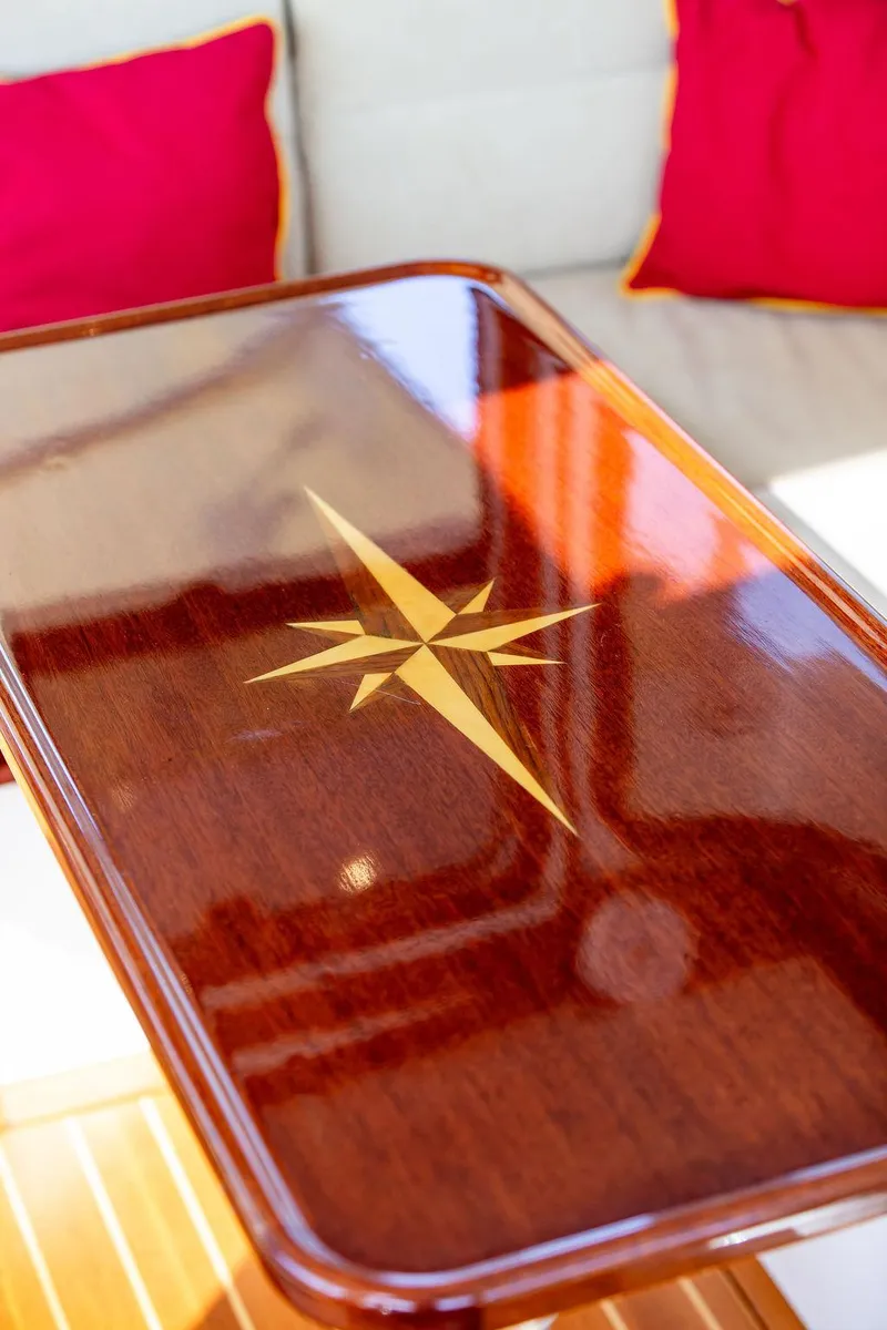 Slide: The Image of Polished wooden table with compass rose design on Bruckmann Abaco 40 yacht, 2014. - 33