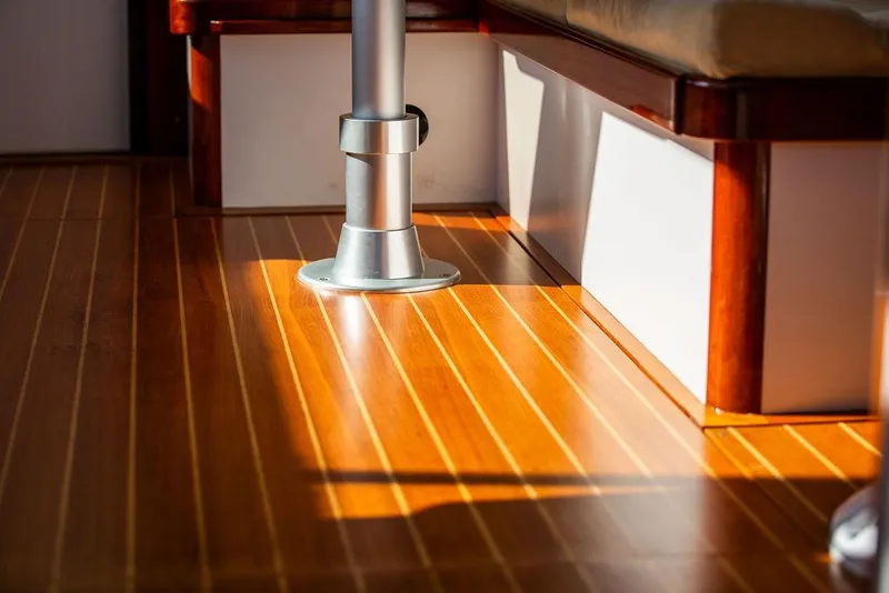 Slide: The Image of Interior of 2014 Bruckmann Abaco 40 yacht with polished wooden flooring and metal fixture. - 34