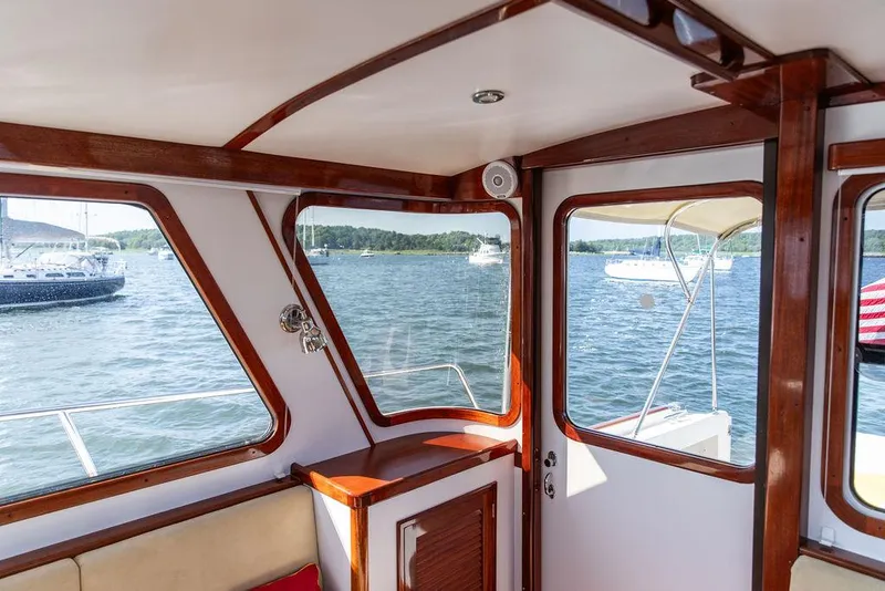 Slide: The Image of Interior view of 2014 Bruckmann Abaco 40 yacht with scenic water and boats outside. - 35