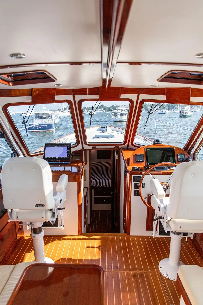 Slide: The Image of Interior of 2014 Bruckmann Abaco 40 yacht with wooden accents and navigation equipment. - 38