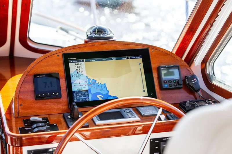 Slide: The Image of Navigation dashboard of 2014 Bruckmann Abaco 40 with electronic displays and controls. - 44