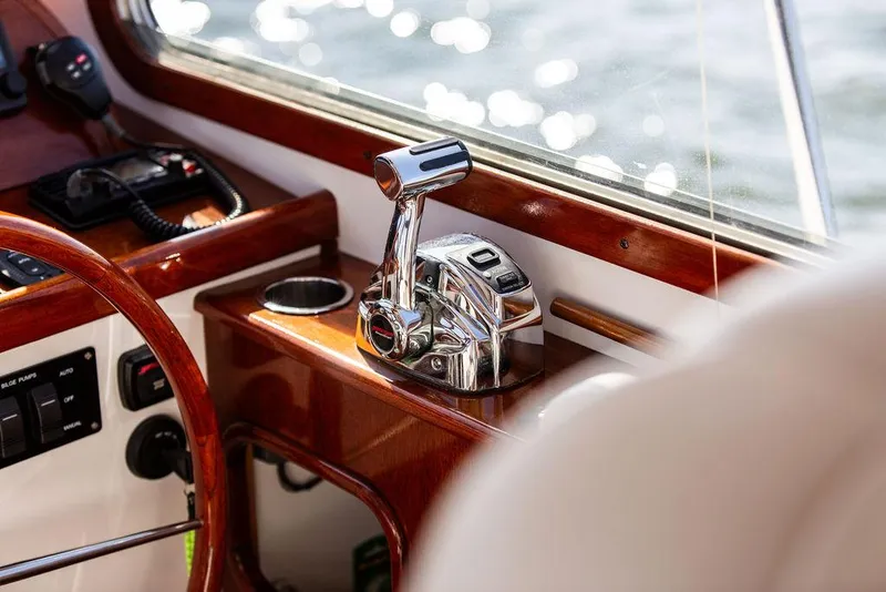 Slide: The Image of Close-up of Bruckmann Abaco 40 yacht controls, featuring polished wood and chrome accents, 2014 model. - 48