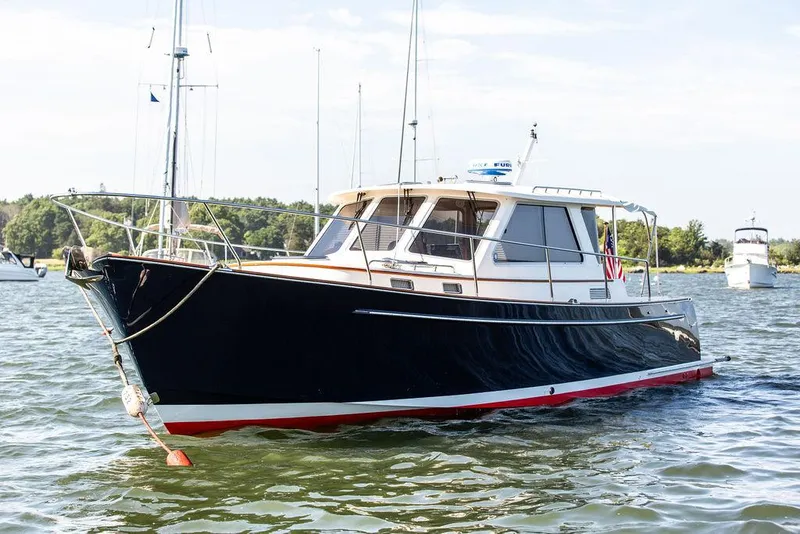 Slide: The Image of 2014 Bruckmann Abaco 40 yacht on calm water, showcasing sleek design and elegance. - 8