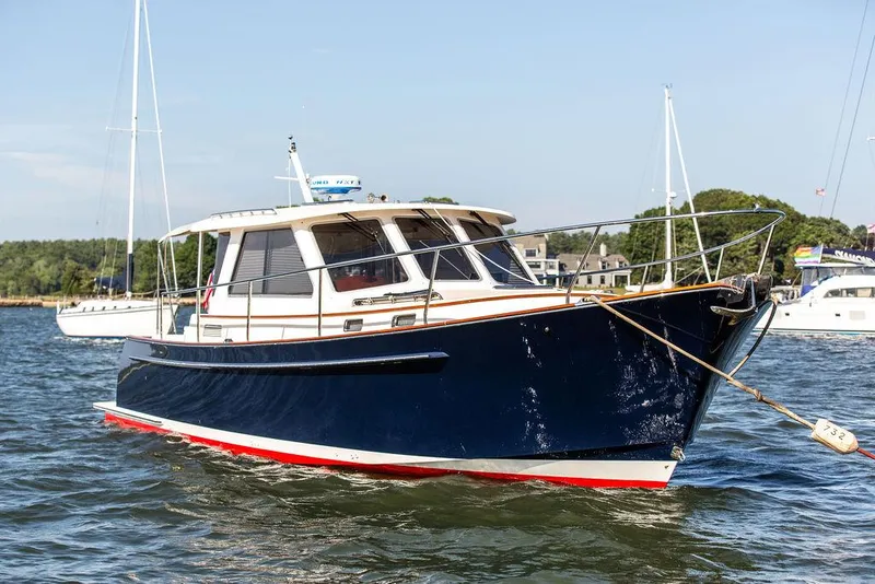 Slide: The Image of 2014 Bruckmann Abaco 40 yacht on water, sunny day, marina background. - 9