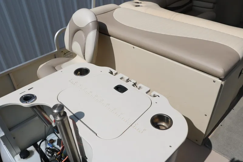 Slide: The Image of 2007 Bennington 2577 RFi boat interior with seating and cup holders. - 14