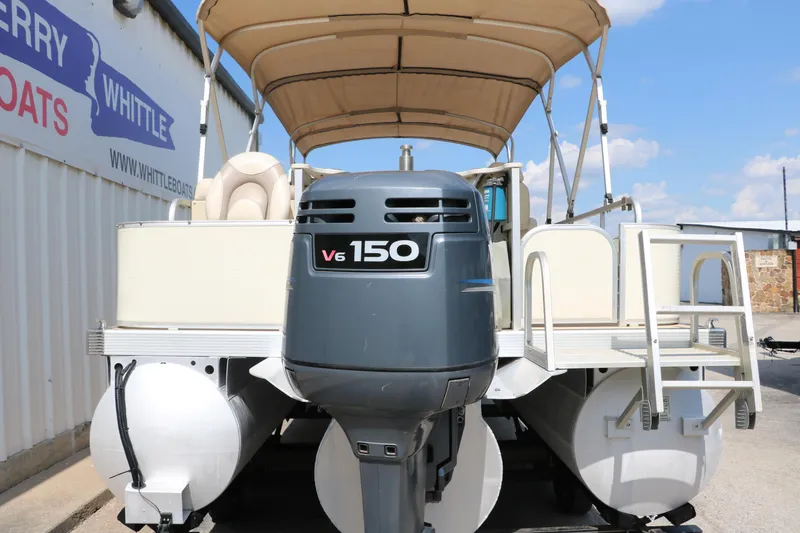 Slide: The Image of 2007 Bennington 2577 RFi pontoon boat with V6 150 engine, docked near Whittle Boats. - 7