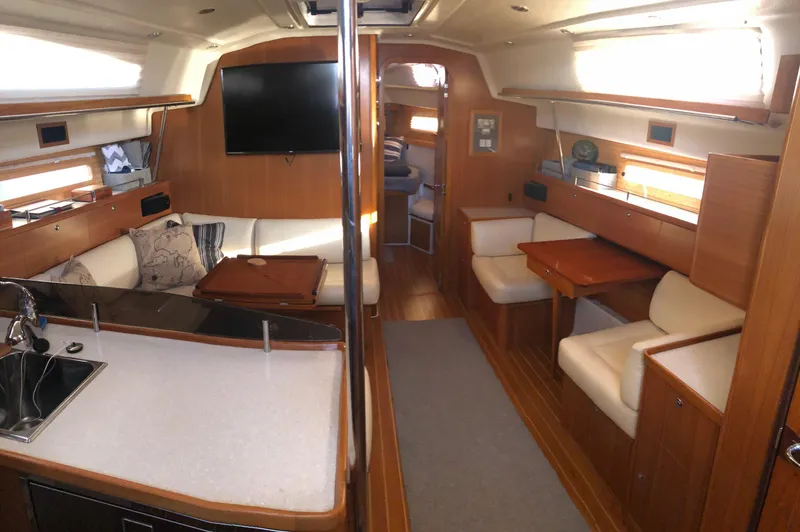 Slide: The Image of Luxurious interior of 2019 Catalina 425 yacht with modern furnishings and wood finish. - 1