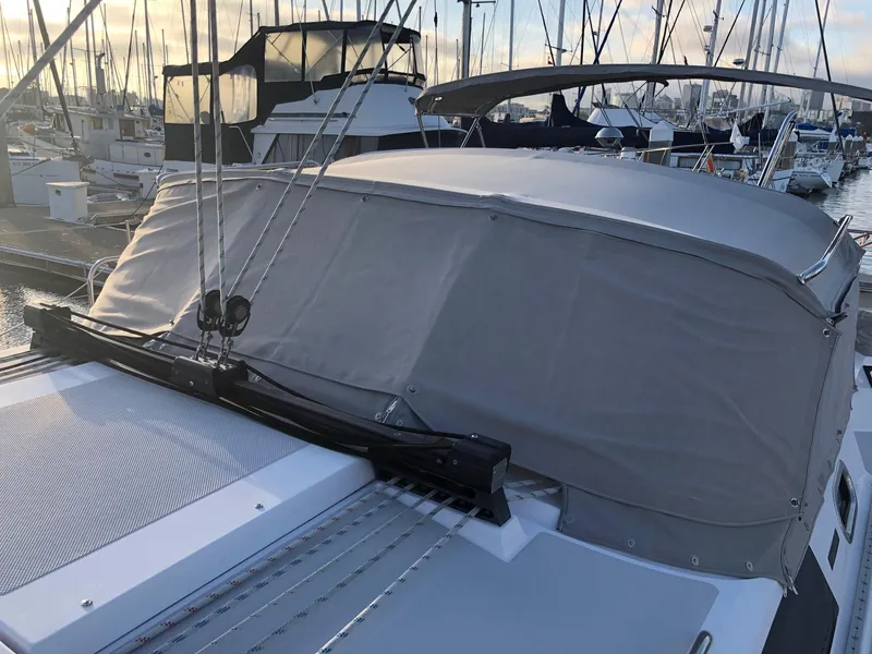 Slide: The Image of 2019 Catalina 425 sailboat with covered deck at marina, surrounded by other boats. - 20