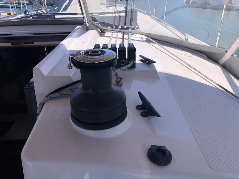 Slide: The Image of Sailboat deck of 2019 Catalina 425 with winch and cleats in sunlight. - 26