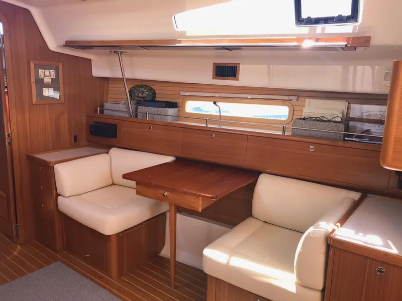 Slide: The Image of Interior of 2019 Catalina 425 yacht with wooden furnishings and white seating. - 3