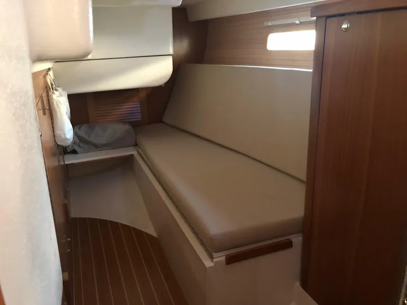 Slide: The Image of Interior cabin of 2019 Catalina 425 sailboat with wooden finish and cushioned seating. - 4