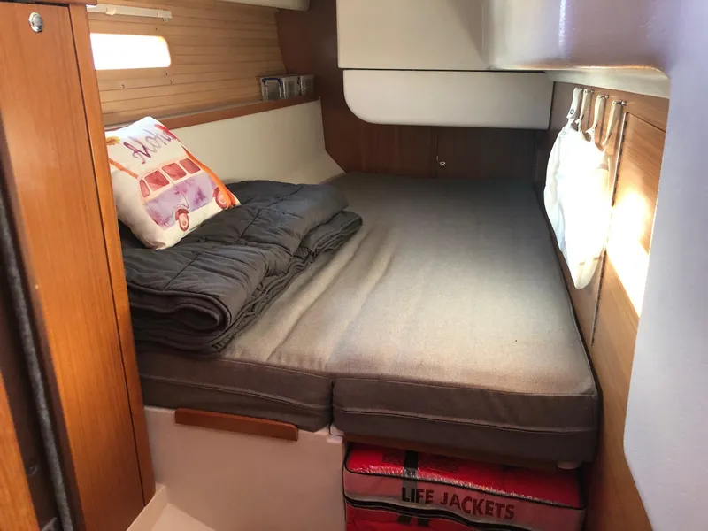 Slide: The Image of Cozy cabin interior of 2019 Catalina 425 sailboat with bed, pillow, and life jackets. - 6