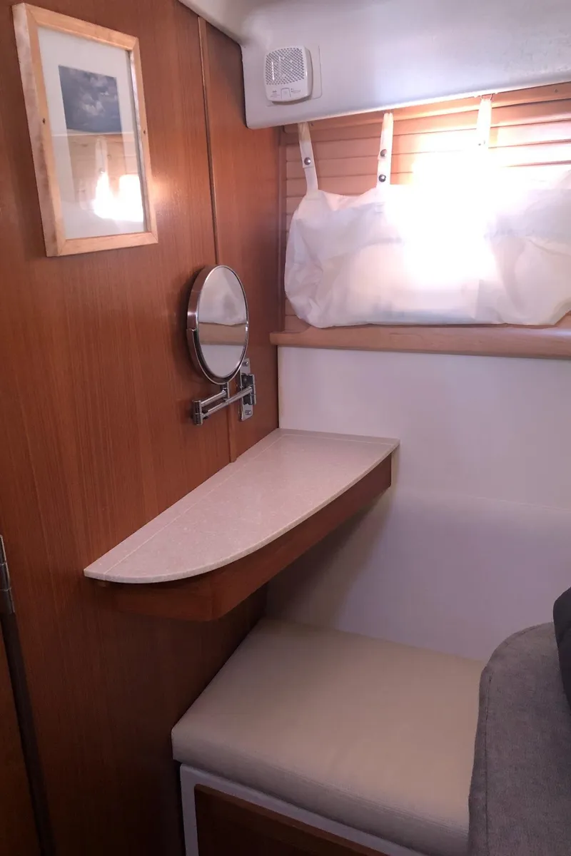 Slide: The Image of Interior of 2019 Catalina 425 yacht with wooden paneling and seating area. - 9