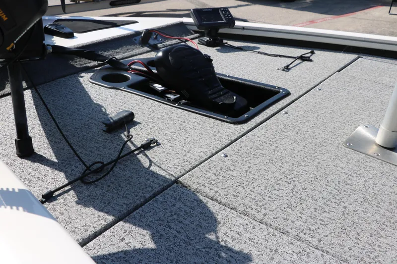 Slide: The Image of 2022 Tracker Pro Team 195 TXW Tournament Edition boat deck with pedal and wiring. - 10