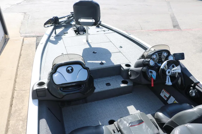 Slide: The Image of 2022 Tracker Pro Team 195 TXW Tournament Edition boat interior with steering console and seating. - 13