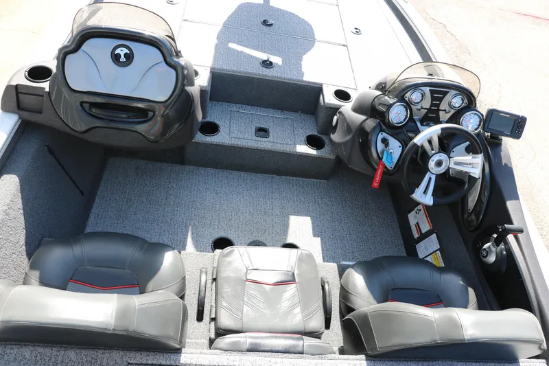 Slide: The Image of 2022 Tracker Pro Team 195 TXW Tournament Edition boat interior with steering console and seating. - 14