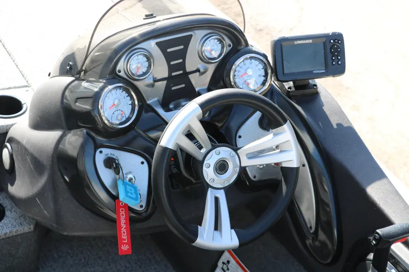 Slide: The Image of 2022 Tracker Pro Team 195 TXW Tournament Edition boat dashboard with gauges and Lowrance fishfinder. - 15