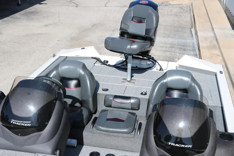Slide: The Image of 2022 Tracker Pro Team 195 TXW Tournament Edition boat interior with seating and consoles. - 17