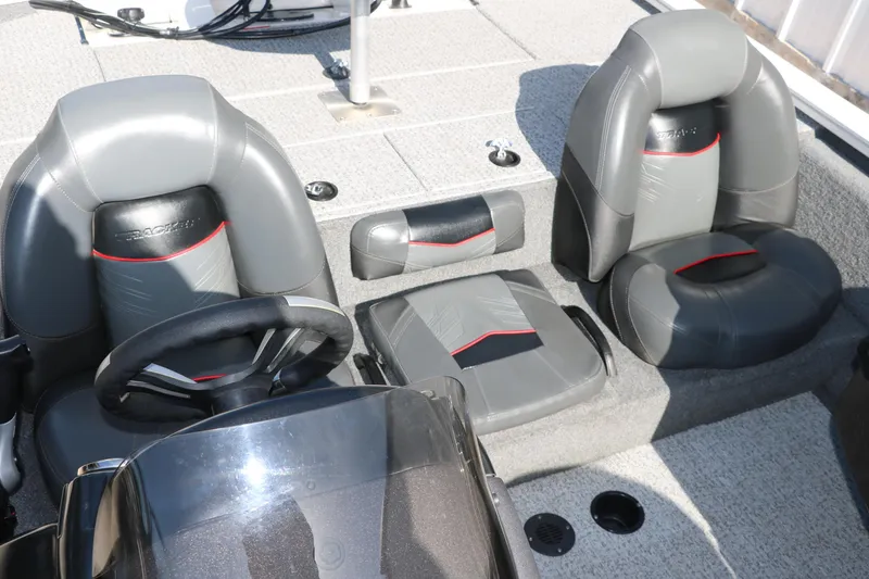 Slide: The Image of 2022 Tracker Pro Team 195 TXW Tournament Edition boat interior with gray and black seating. - 19