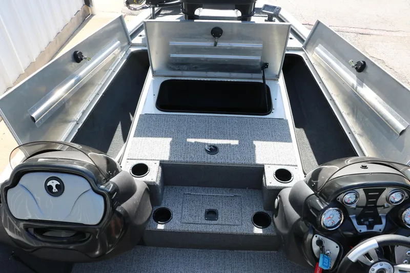 Slide: The Image of 2022 Tracker Pro Team 195 TXW Tournament Edition boat interior with open storage compartments. - 22