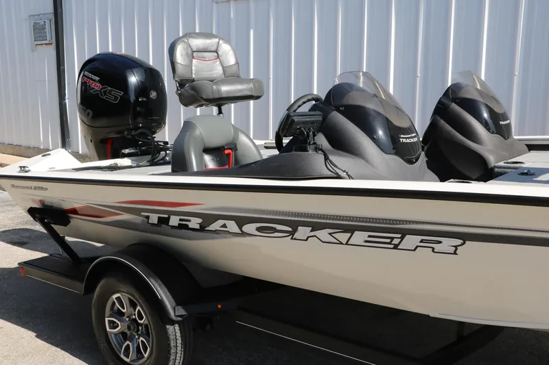 Slide: The Image of 2022 Tracker Pro Team 195 TXW Tournament Edition boat with motor, parked outdoors. - 25