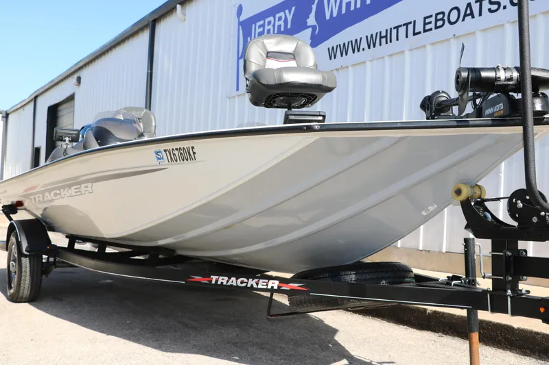 Slide: The Image of 2022 Tracker Pro Team 195 TXW Tournament Edition boat on trailer outside dealership. - 5