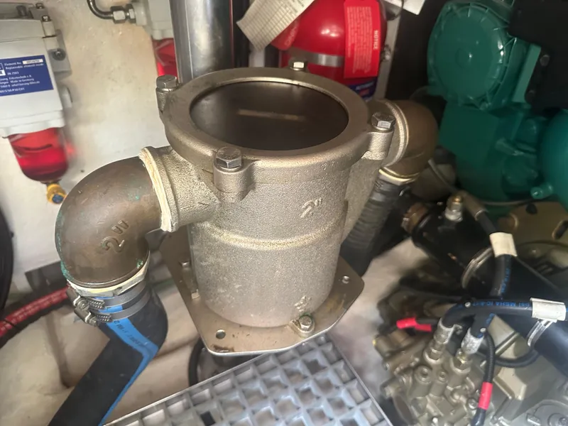 Slide: The Image of Engine room of 2016 Galeon 380 Fly, featuring a metal component with attached hoses. - 13