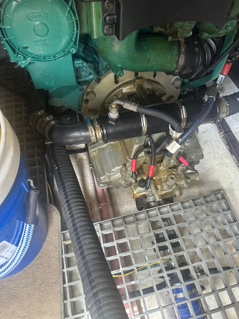 Slide: The Image of Engine compartment of 2016 Galeon 380 Fly yacht, featuring mechanical components and hoses. - 20