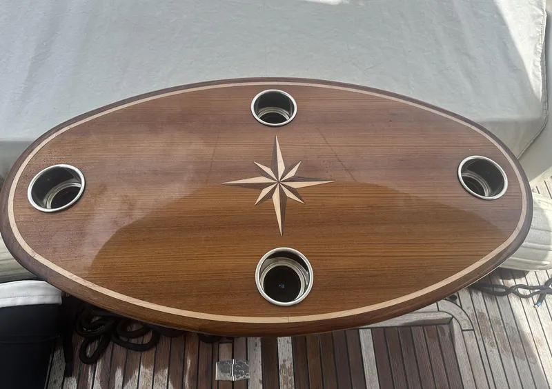 Slide: The Image of Wooden table with star design and cup holders on Galeon 380 Fly, 2016 model. - 21