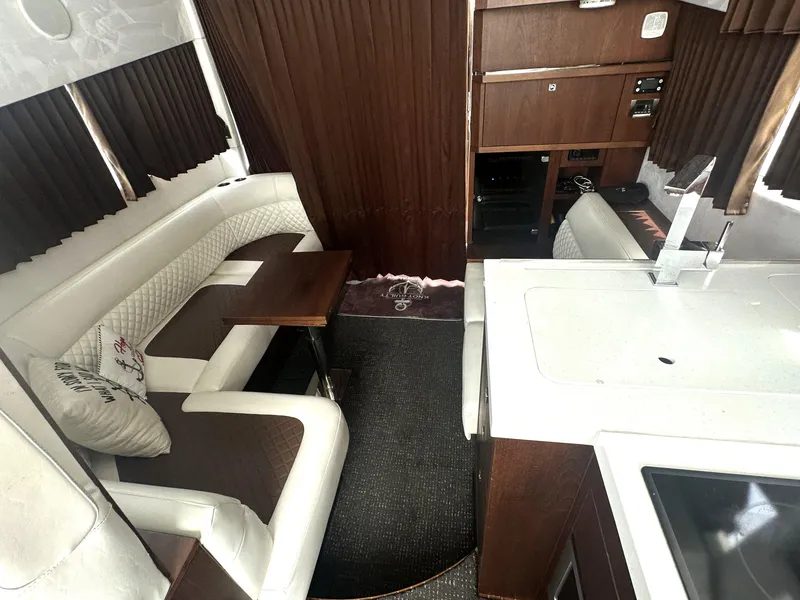 Slide: The Image of Interior of 2016 Galeon 380 Fly yacht with elegant seating and modern kitchen area. - 3