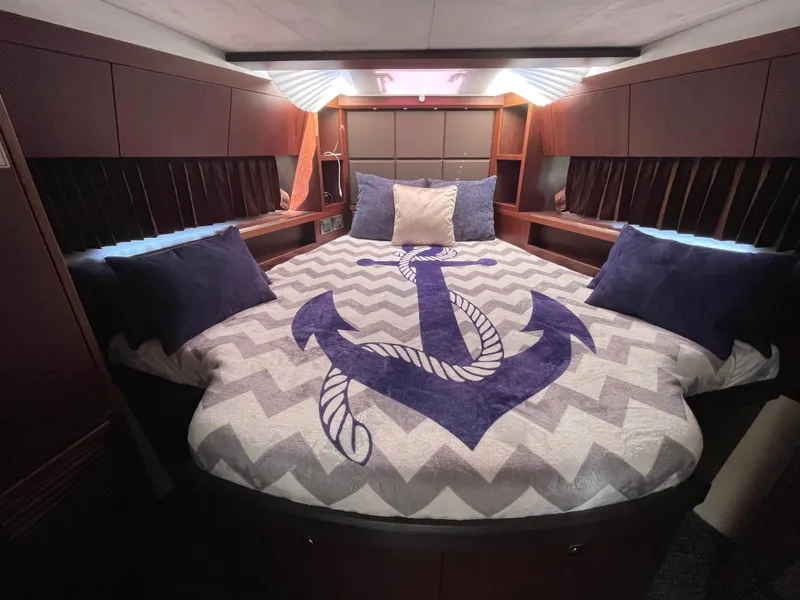 Slide: The Image of Luxurious bedroom in 2016 Galeon 380 Fly yacht with anchor-themed bedding. - 4