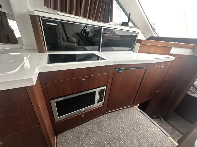 Slide: The Image of Modern kitchen interior of 2016 Galeon 380 Fly yacht with sleek cabinetry and appliances. - 8