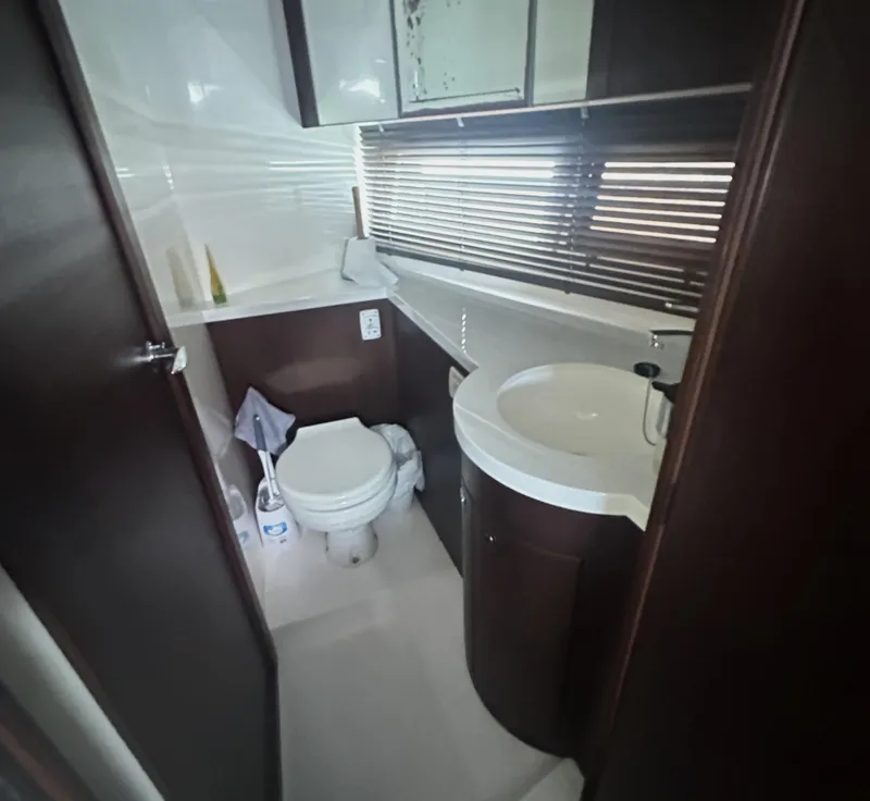 Slide: The Image of Bathroom interior of 2016 Galeon 380 Fly yacht with modern fixtures and wooden accents. - 9