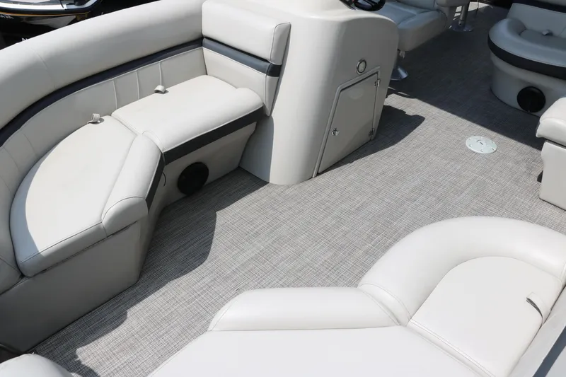Slide: The Image of Interior of a 2019 Berkshire 20RFC CTS pontoon boat with plush seating and carpeted flooring. - 18
