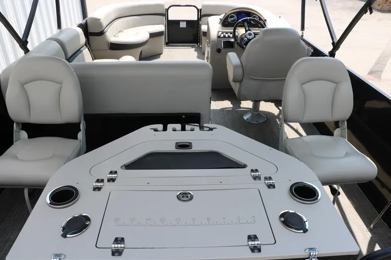 Slide: The Image of 2019 Berkshire 20RFC CTS pontoon boat interior with seating and control panel. - 23