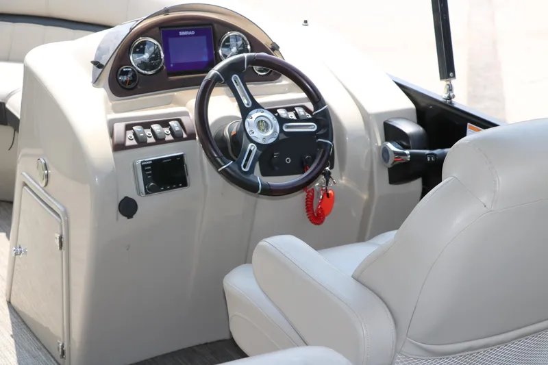 Slide: The Image of 2019 Berkshire 20RFC CTS boat dashboard with steering wheel and control panel. - 25