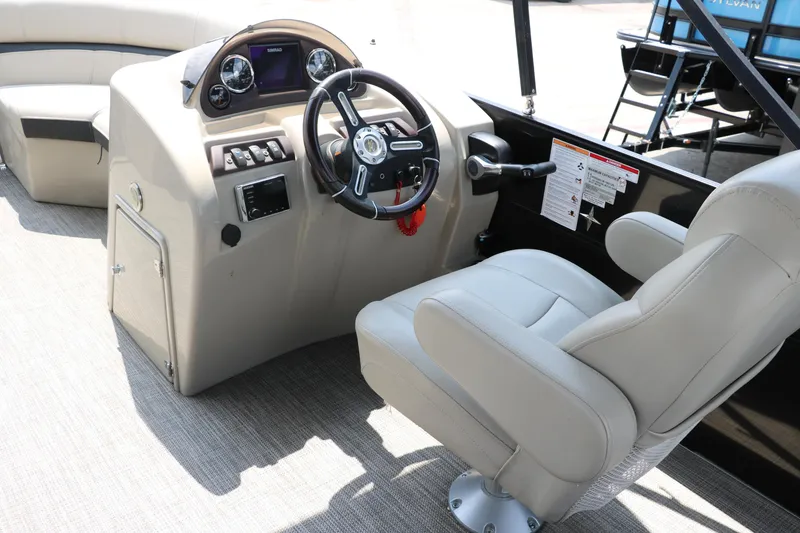 Slide: The Image of 2019 Berkshire 20RFC CTS boat interior with steering wheel and captain's chair. - 29