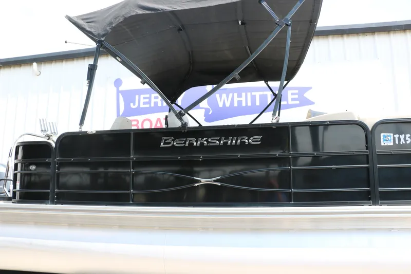 Slide: The Image of 2019 Berkshire 20RFC CTS pontoon boat with black canopy and railing. - 3