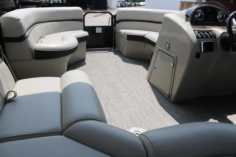 Slide: The Image of 2019 Berkshire 20RFC CTS pontoon boat interior with plush seating and modern dashboard. - 30