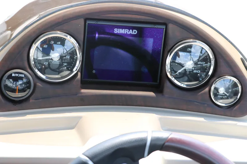 Slide: The Image of Dashboard of 2019 Berkshire 20RFC CTS boat with Simrad display and gauges. - 32